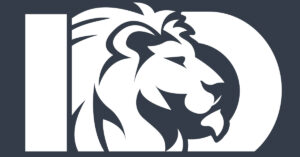A creative white silhouette of a lion’s head facing right is inside a bold, white uppercase letter D on a dark background. The lion’s mane extends to the left, overlapping a white rectangle beside the D.